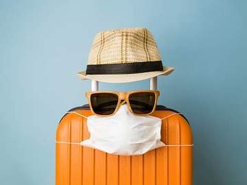 suitcase with mask and sunglasses on it